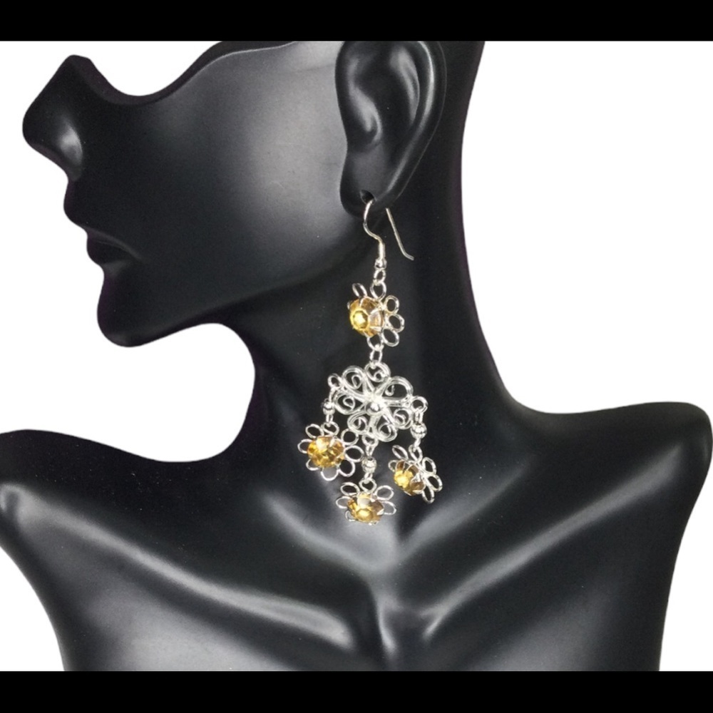 Zad silver dangling earrings with topaz stones